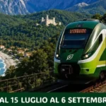 Treno regionale "Lunigiana Express" in transito sul viadotto della ferrovia Pisa-La Spezia, con vista sulle Alpi Apuane e il borgo di Equi Terme sullo sfondo
